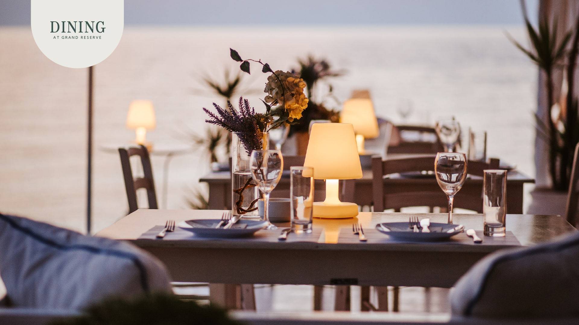 Grand Reserve's dining ambiance at sunset, where guests dine al fresco, enjoying the exquisite flavors and the stunning backdrop of the setting sun.