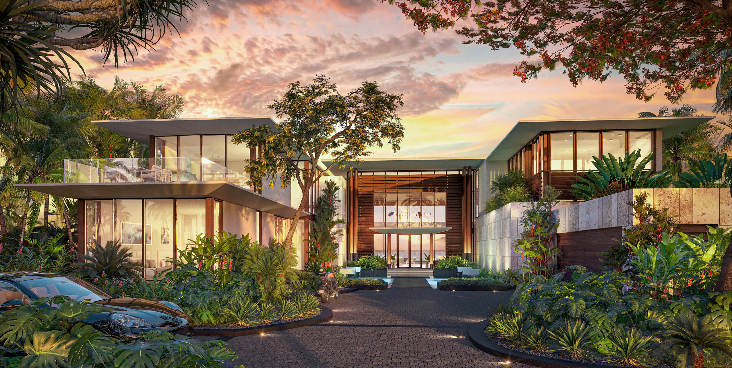 Grand Reserve's Villa 1 exterior view showcases modern architecture and lush tropical landscaping, inviting guests into a world of exclusivity.